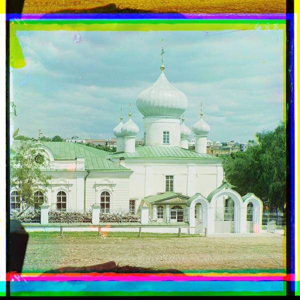 religious_building_with_onion_domes_and_arched_gateway.jpg